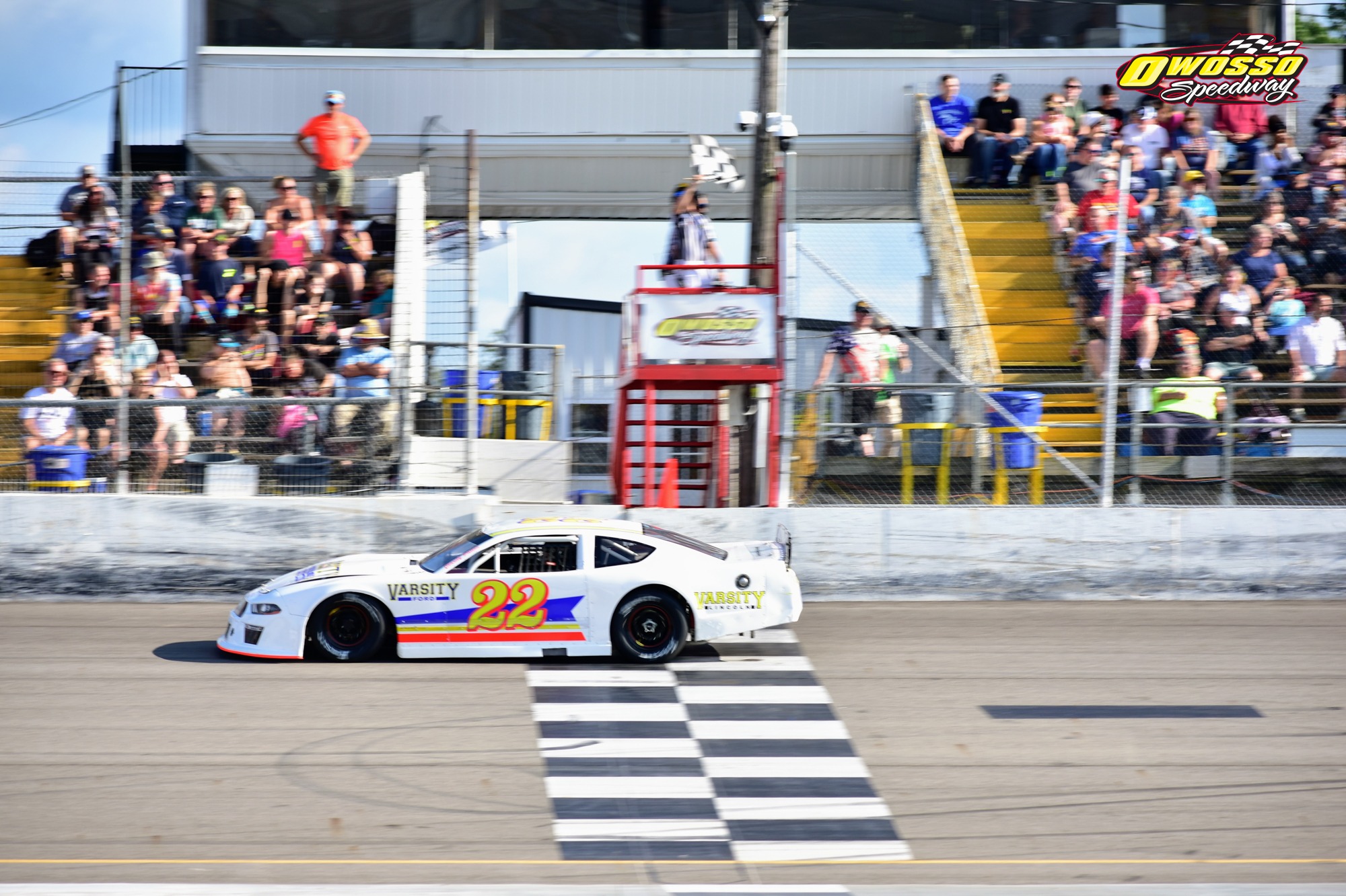 Number 22 crossing the finish line at Owosso Speedway
